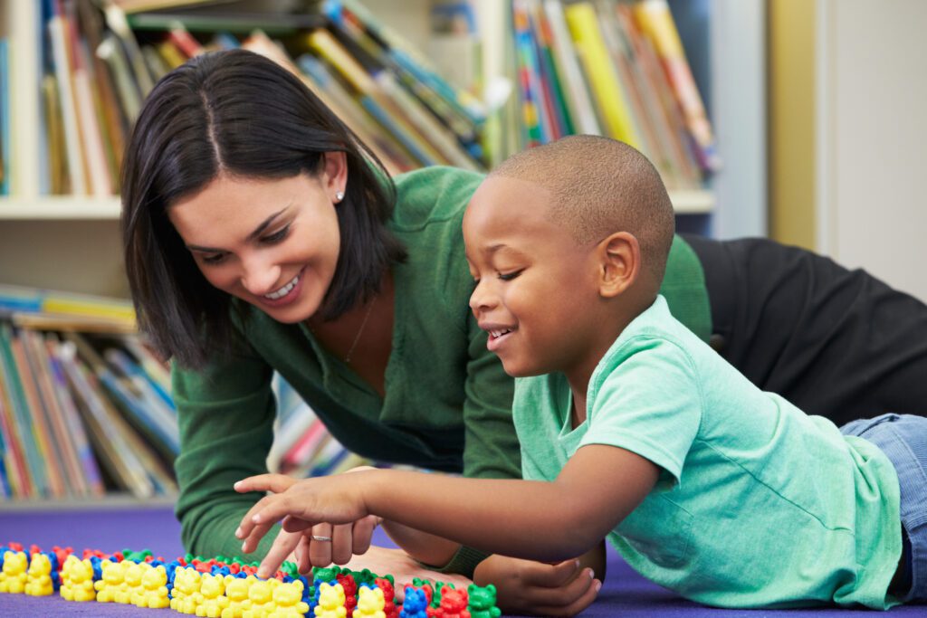 A Woman and Child Joyfully Engage With Vibrant Toys